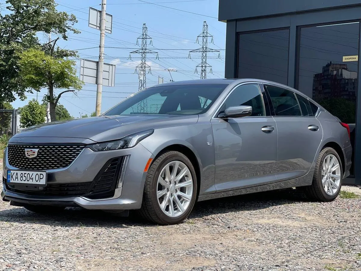 Gray 2020 Cadillac CT5 on a gravel yard next to a black pavilion